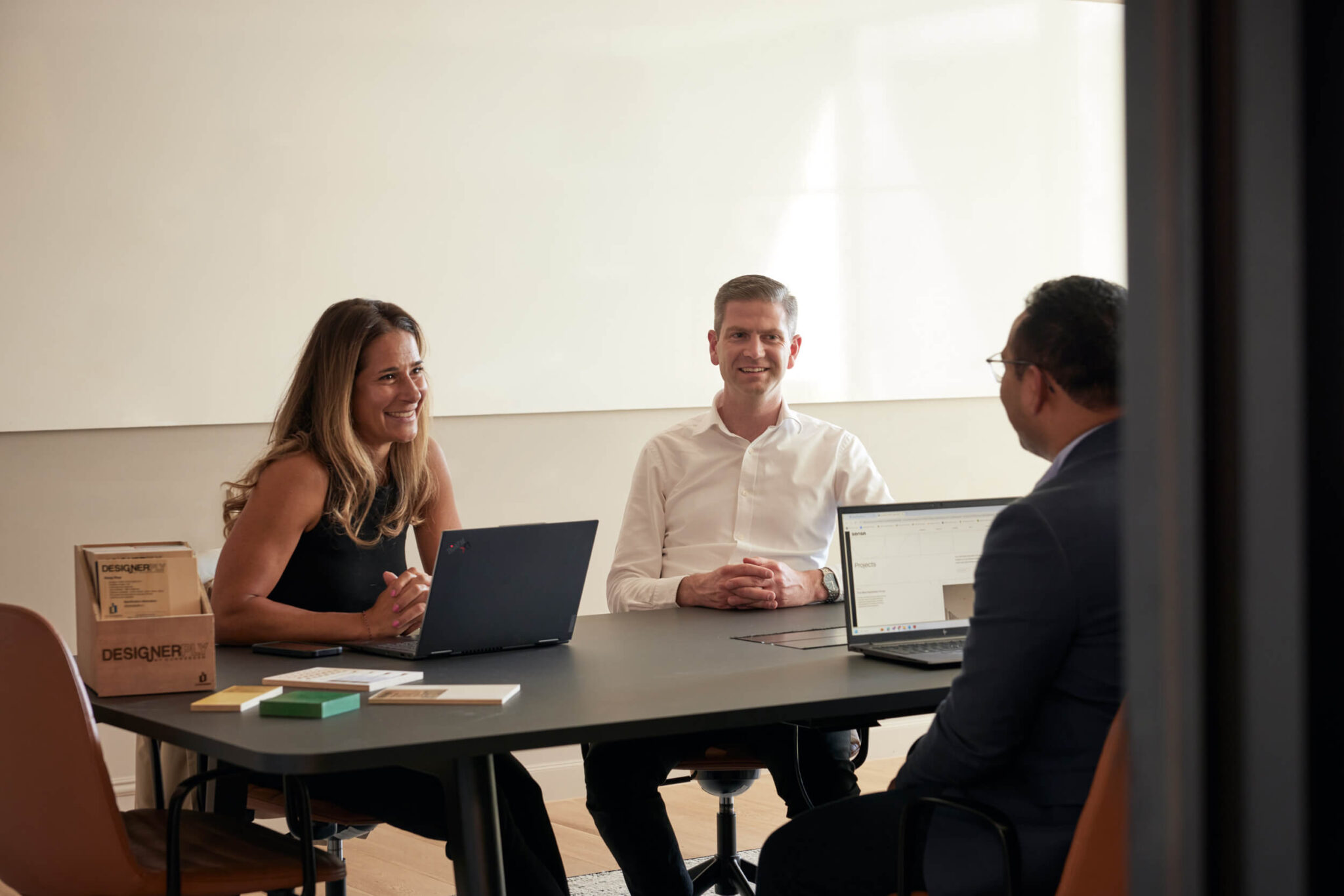 Persons in meeting room