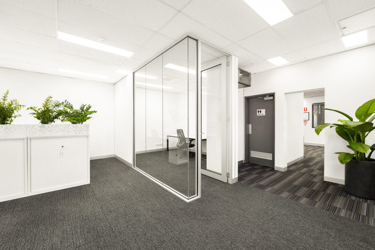 Private cabin space for employees with a glass door.