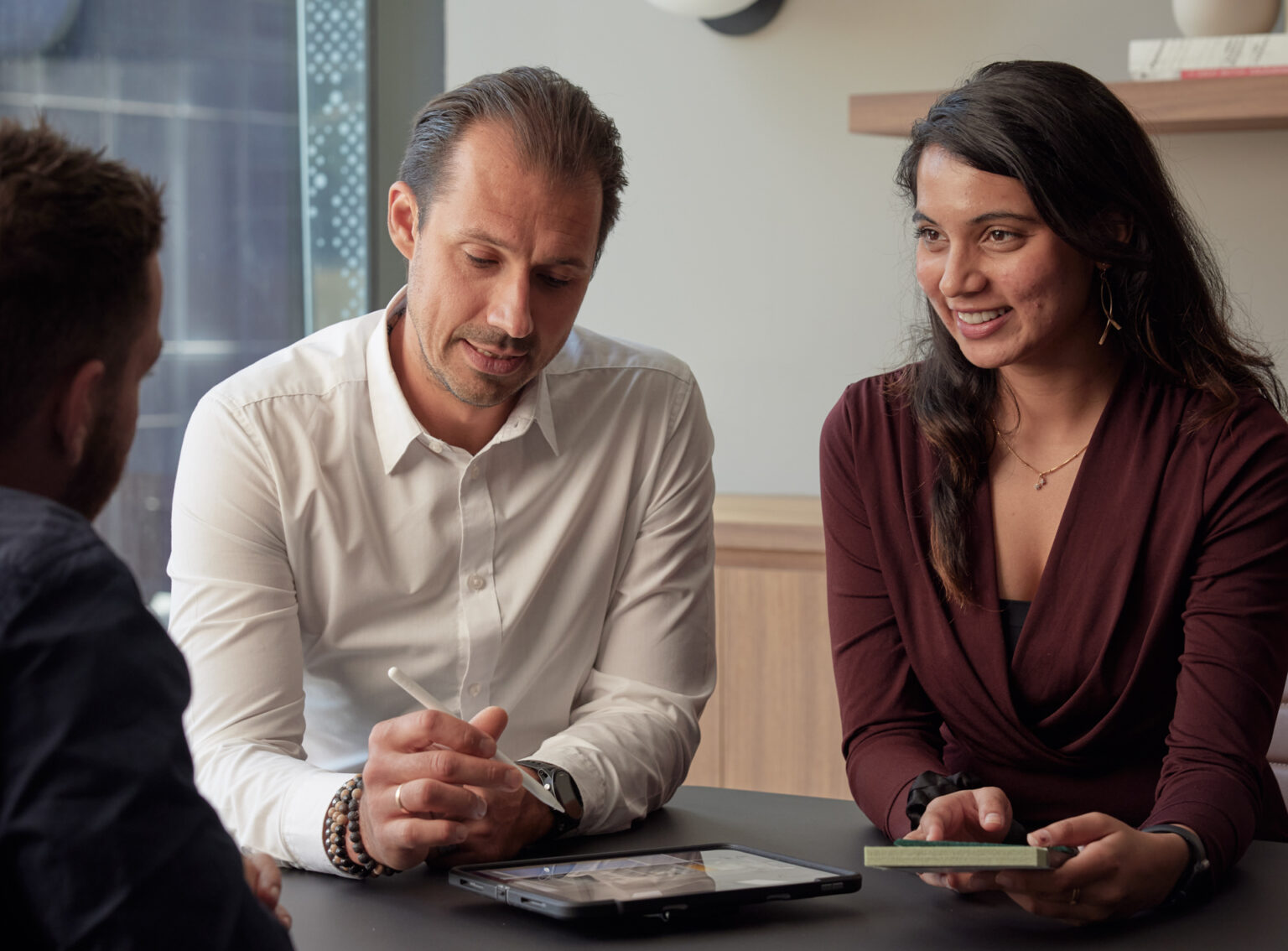 3 people discussion about interior designs