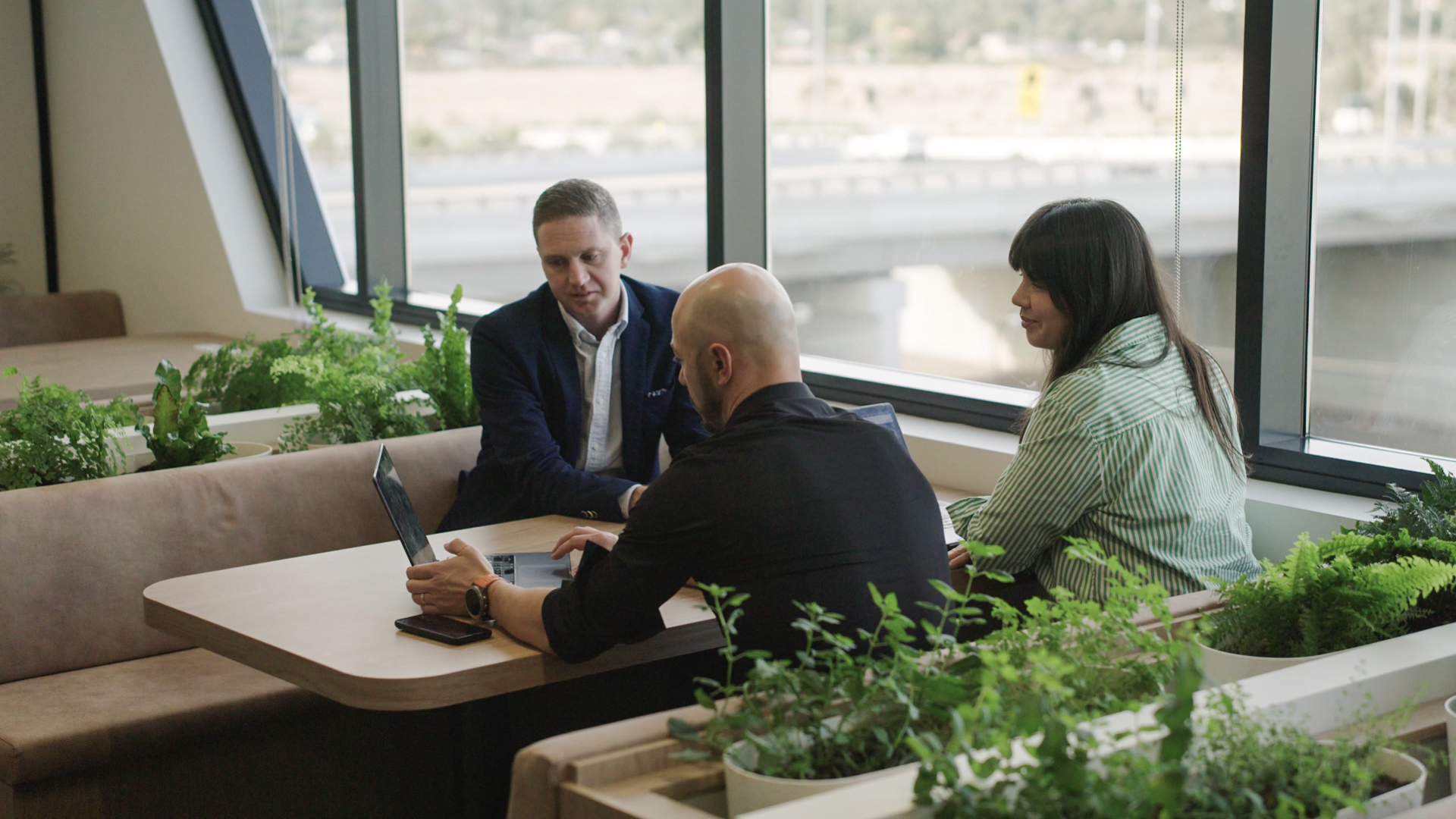 Office discussion between 3 employees